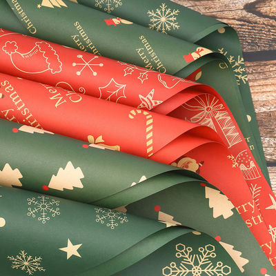 Καλή τιμή. Ανερόστερο χαρτί περιτύλιξης με θέμα τα Χριστούγεννα για μπουκέτα τριαντάφυλλων σε απευθείας σύνδεση